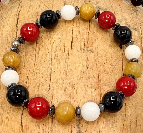 Stylish Burberry bracelet by STICS and STONES featuring iconic check pattern and elegant metal design.