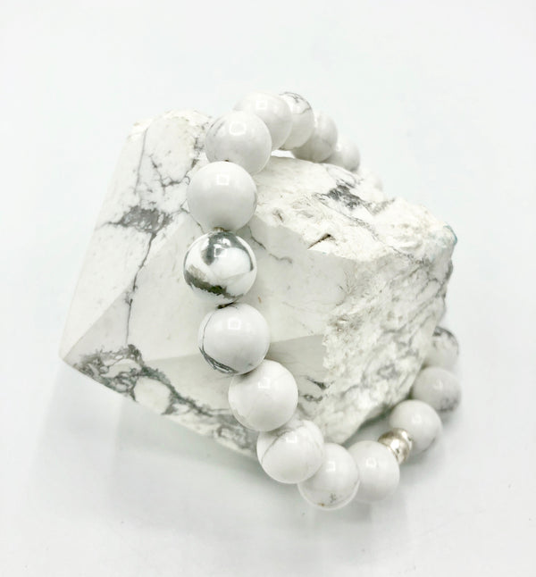 Sterling Howlite bracelet from STICS and STONES featuring smooth, white, marbled stones on a stylish elastic band.