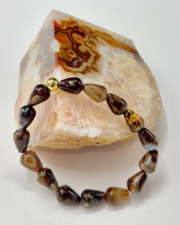 Brown agate cone-shaped bracelet by STICS and STONES featuring polished agate beads and a stylish design.