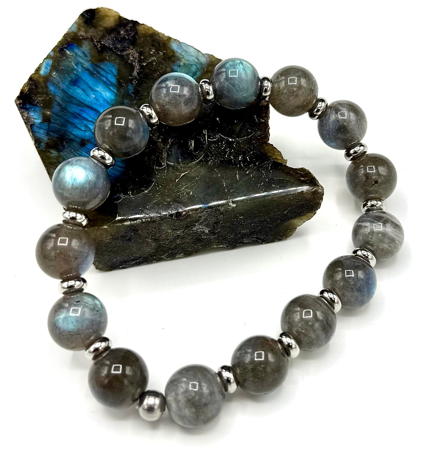 Labradorite bracelet featuring polished, iridescent stones on a delicate silver chain, crafted by STICS and STONES.