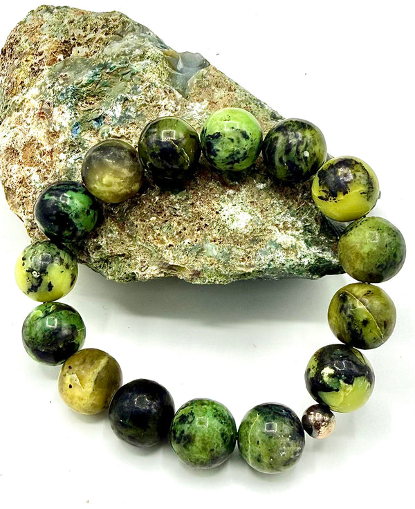 Green serpentine bracelet by STICS and STONES featuring polished serpentine stones and a simple clasp design.