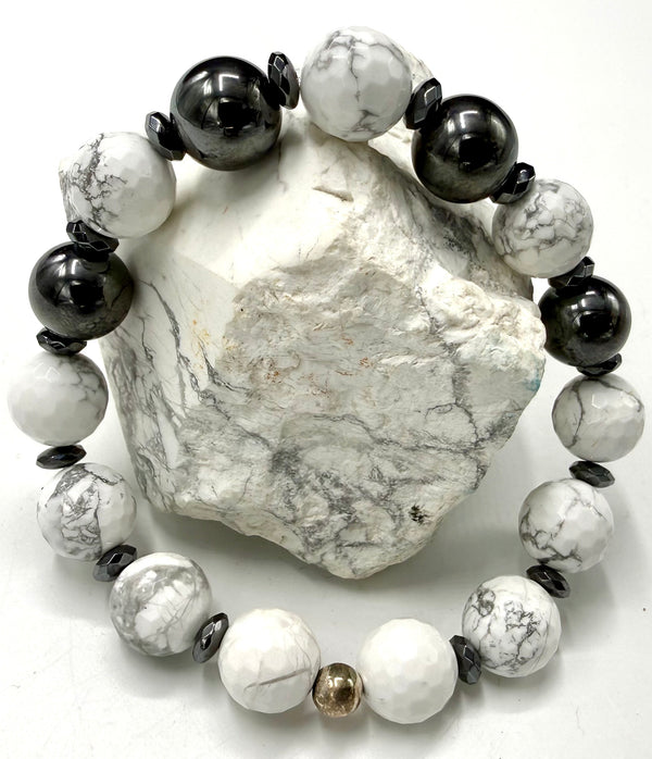 Howlite and hematite bracelet featuring smooth beads, stylish jewelry piece by STICS and STONES displayed in a close-up shot.