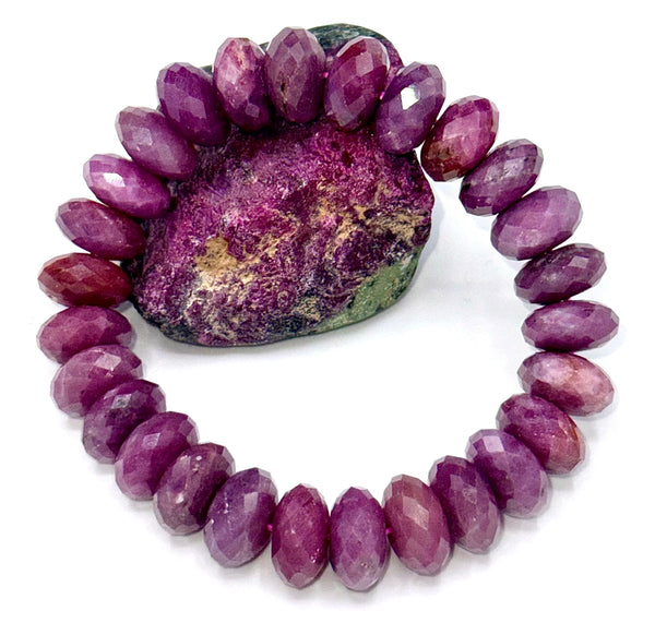 Faceted ruby bracelet by STICS and STONES featuring vibrant red gemstones and a sleek silver clasp.