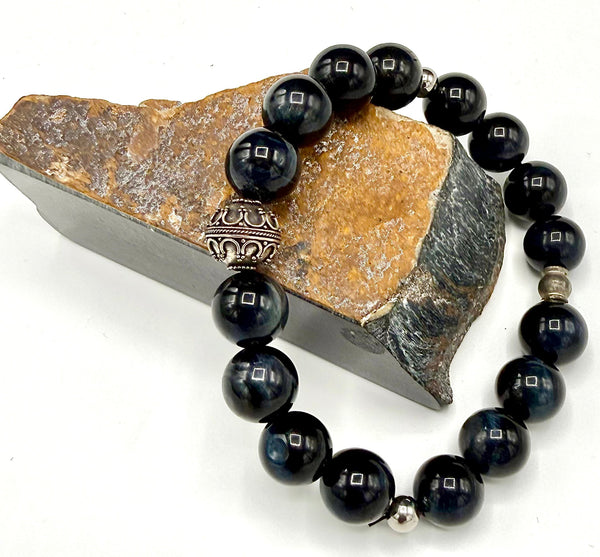 Blue Tiger Eye bracelet featuring natural polished stones, designed by STICS and STONES, with a close-up of the beaded design.