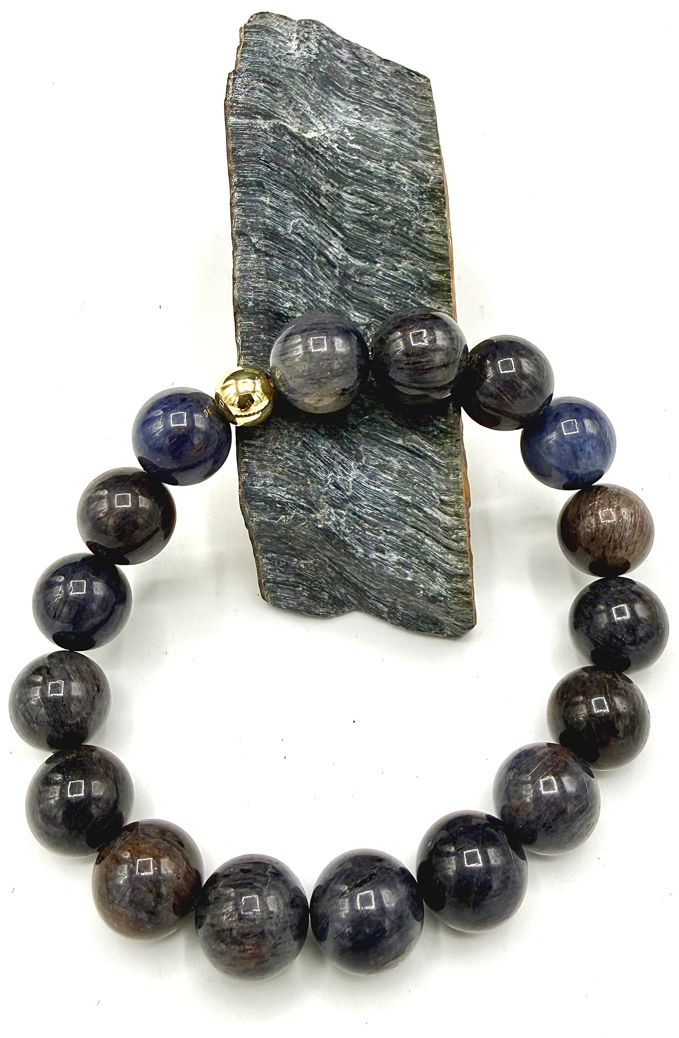 Elegant sapphire bracelet by STICS and STONES featuring vibrant blue sapphires and a delicate silver chain.