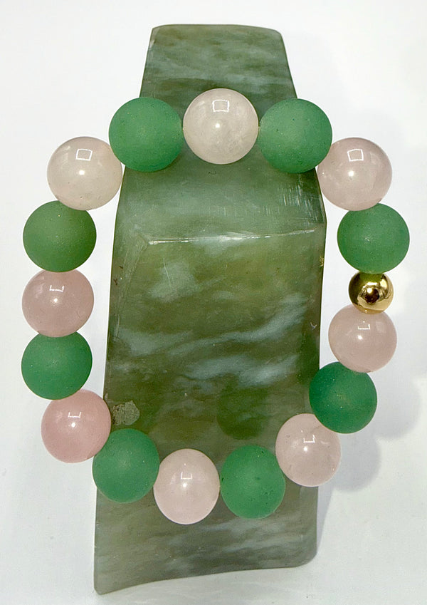 Green Aventurine and Rose Quartz bracelet with beaded design, featuring natural gemstones on a stretchy cord.