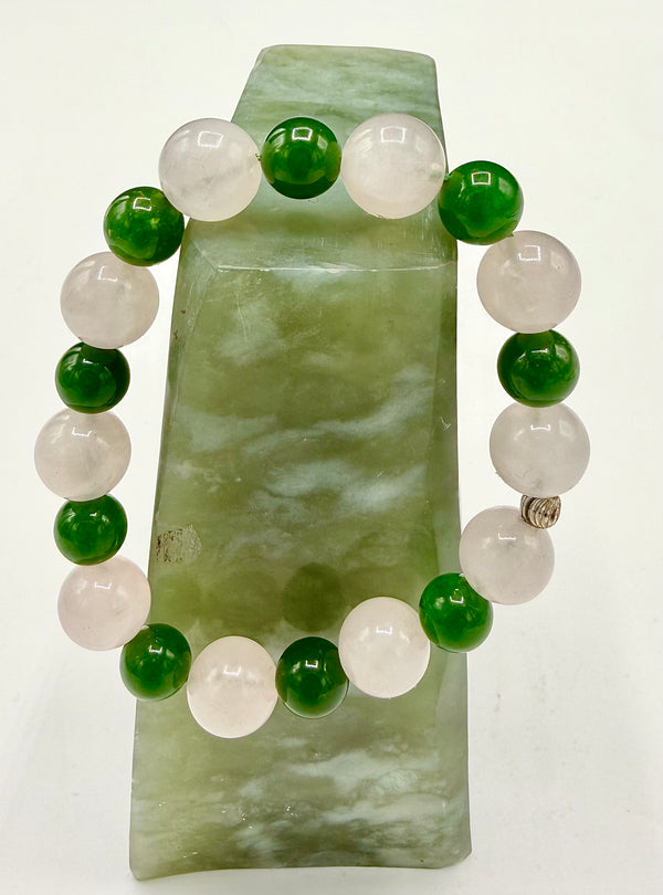 Rose quartz and green agate bracelet by STICS and STONES featuring polished beads on an elastic band.