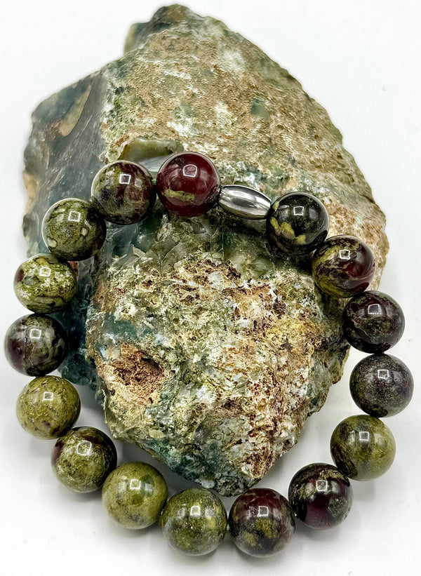 Dragon Bloodstone bracelet by STICS and STONES featuring polished bloodstone beads on an elastic band.