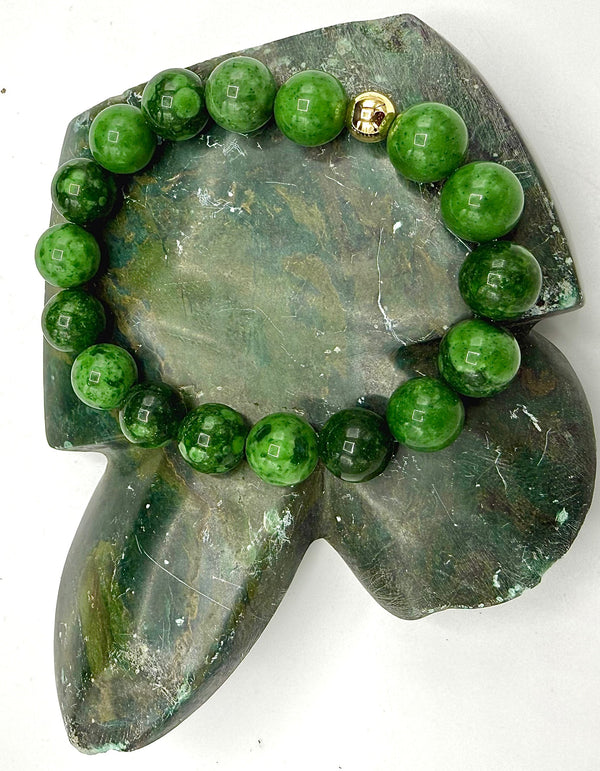Green African Jade bracelet by STICS and STONES featuring smooth beads and natural stone texture.