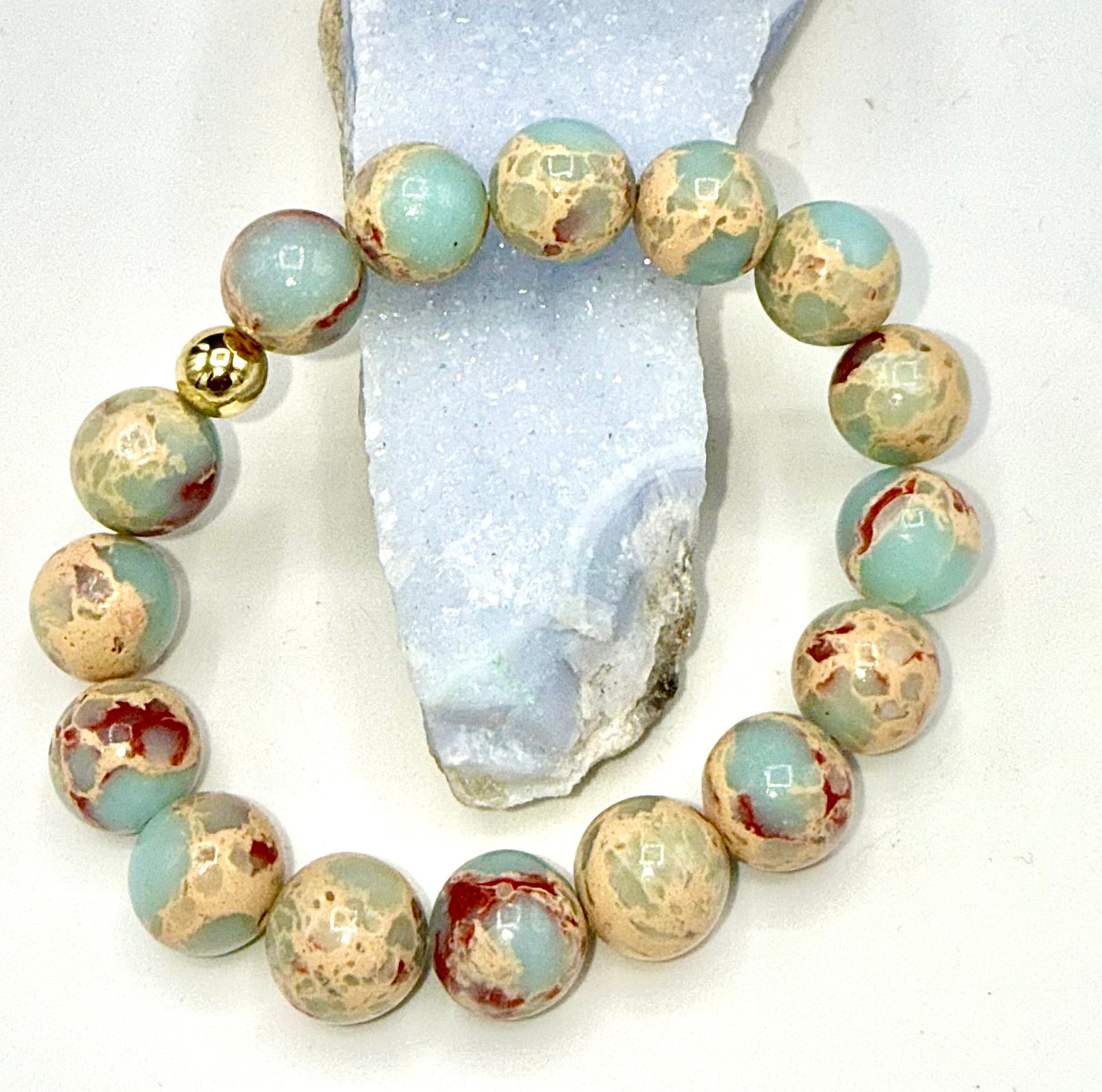 Aqua Terra Jasper bracelet by STICS and STONES featuring polished natural stone beads on an elastic band.