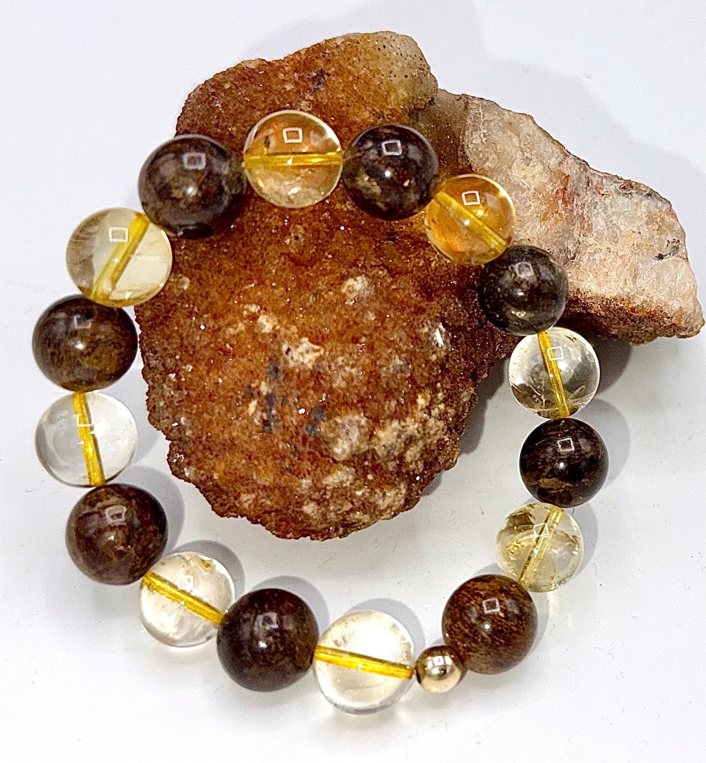 Bronzite and citrine beaded bracelet featuring natural stones and a silver clasp, handcrafted by STICS and STONES.