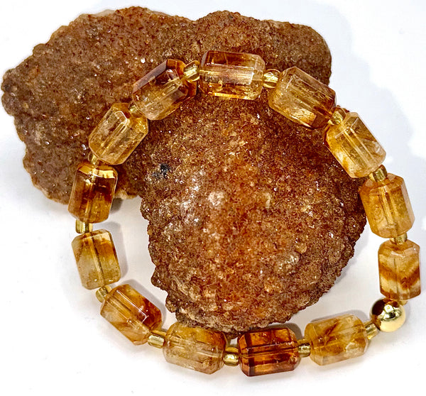 Citrine rectangle bracelet by STICS and STONES featuring polished yellow-orange gemstone beads on a flexible cord.