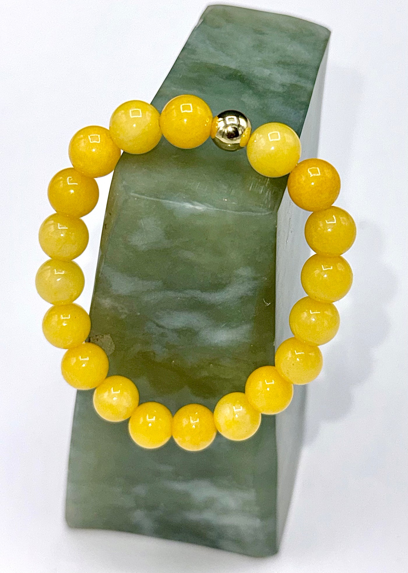 Yellow quartz bracelet featuring smooth, polished stones on an elastic band, crafted by STICS and STONES.