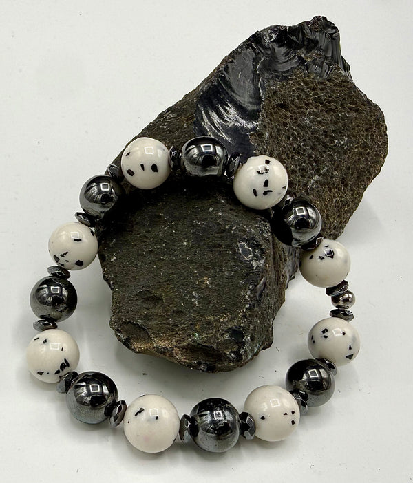 Dalmation Jasper bracelet featuring natural spotted stone beads, crafted by STICS and STONES, displayed on a neutral background.