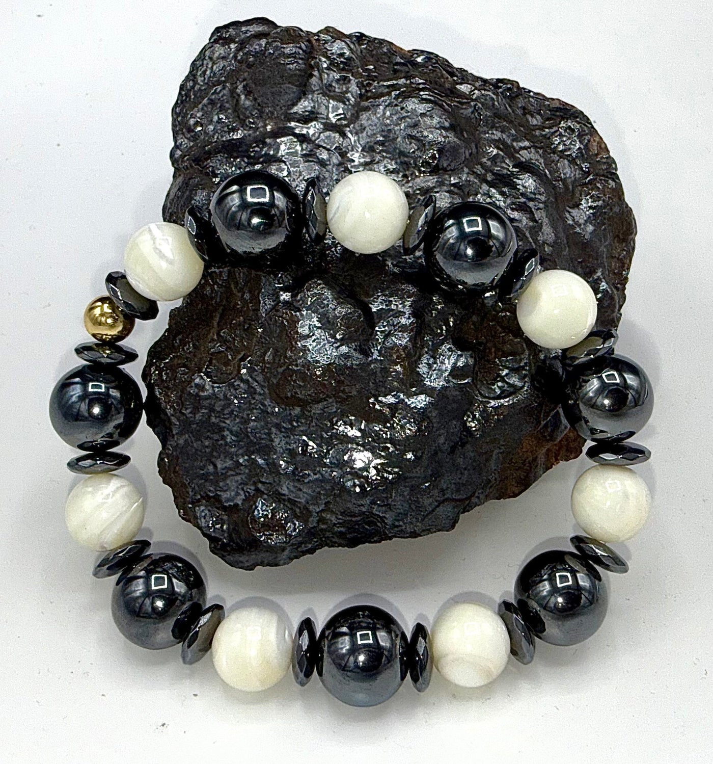 Hematite and pearl bracelet featuring alternating black hematite beads and white pearls, elegant jewelry by STICS and STONES.