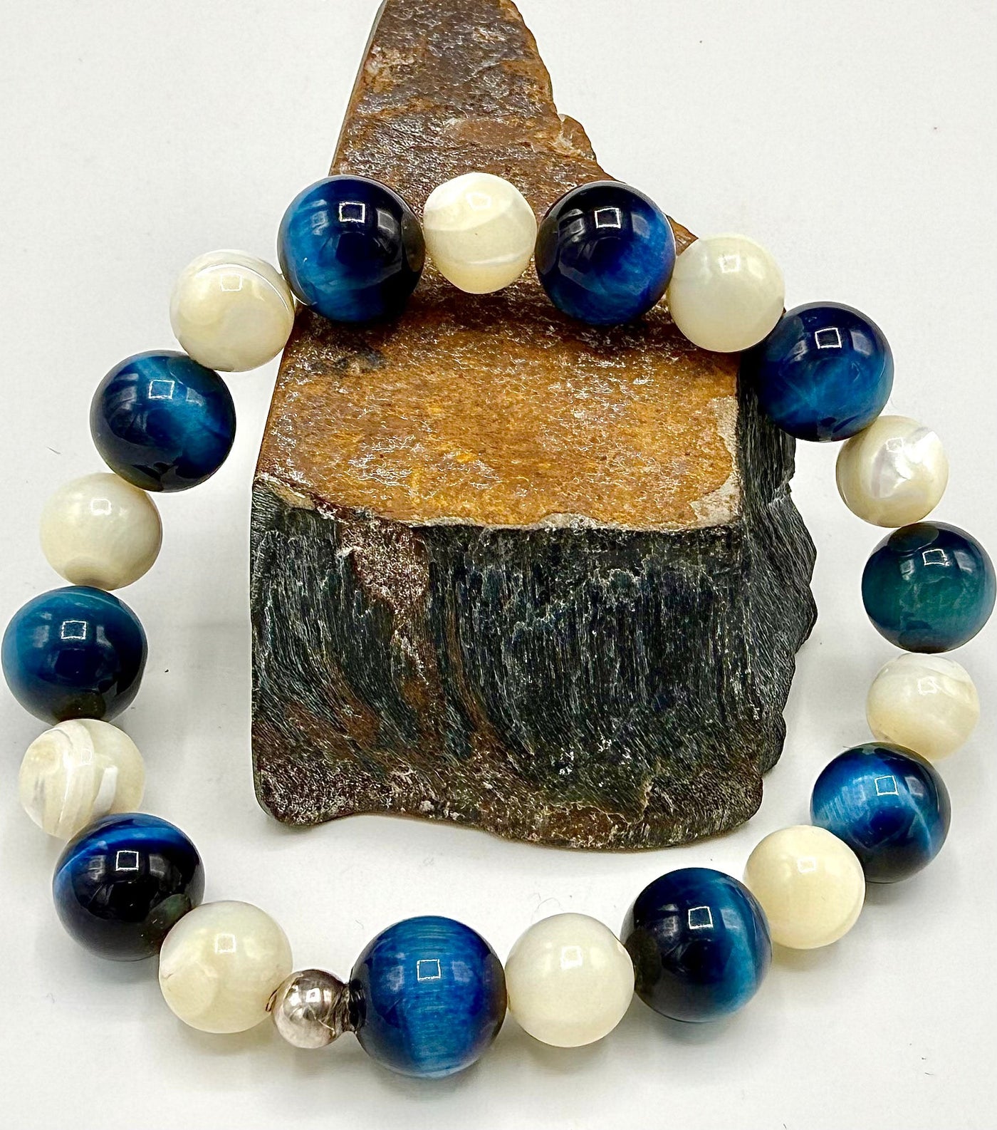 Blue tiger eye and pearl bracelet from STICS and STONES featuring polished beads on a delicate string.
