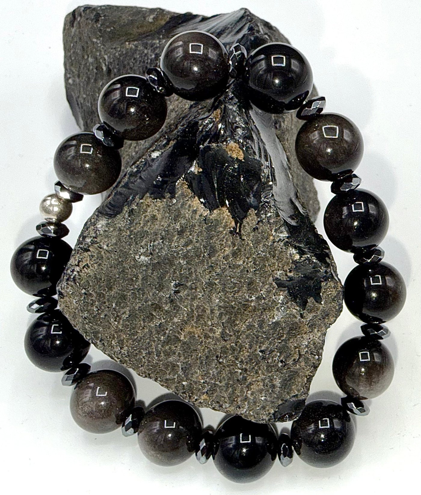 Silver Obsidian bracelet featuring polished black stone beads with silver accents, stylish jewelry by STICS and STONES.