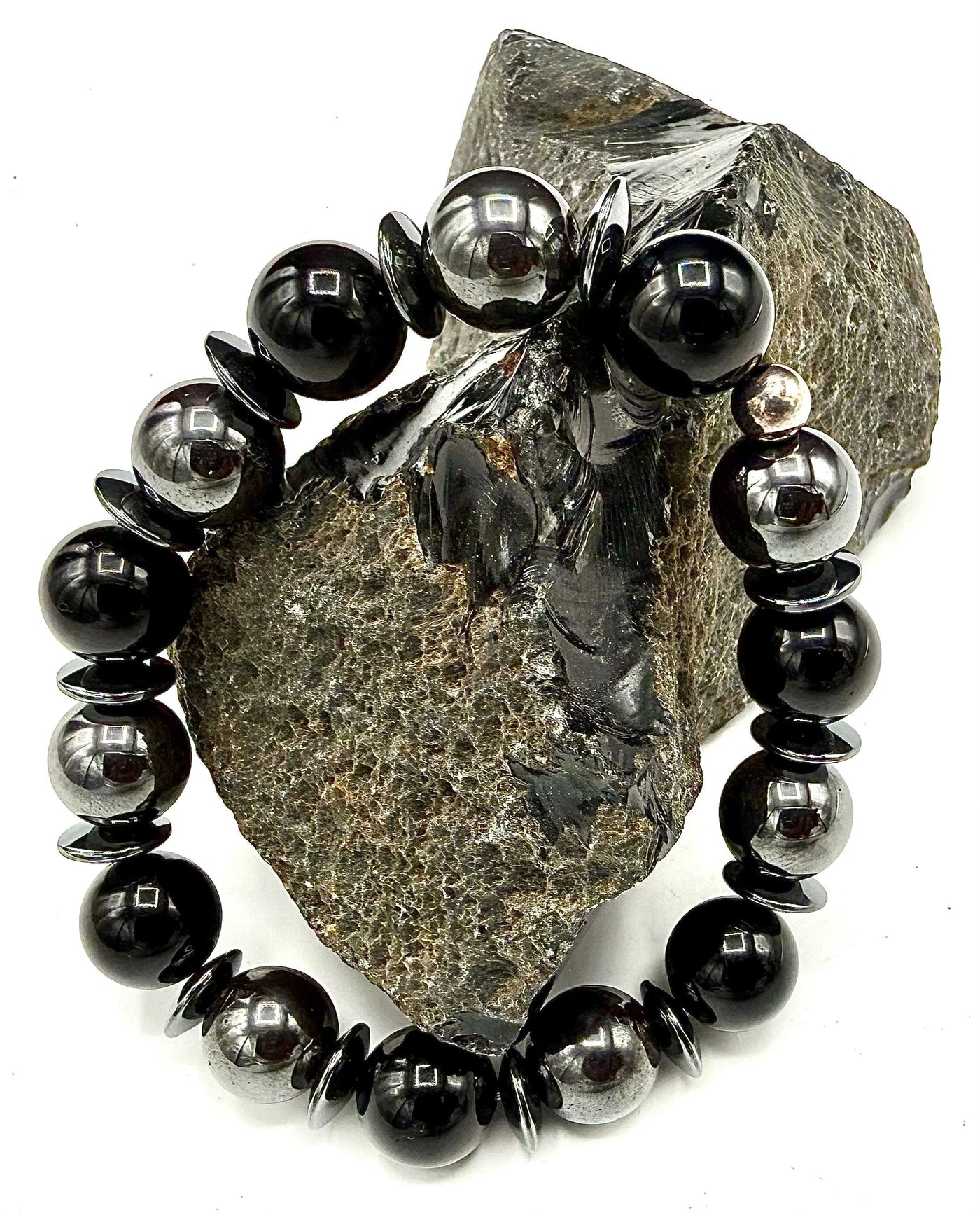 Black Onyx and Hematite round bracelet from STICS and STONES featuring polished beads and an adjustable cord.