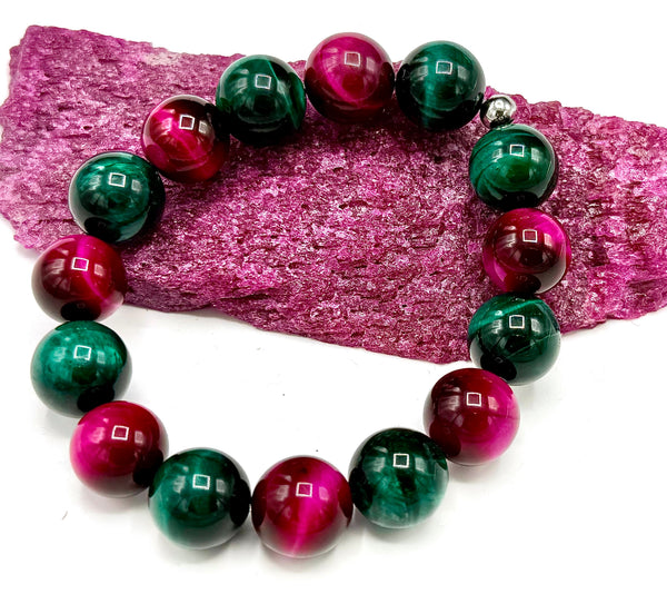 Multi-colored pink and green tiger eye bracelet by STICS and STONES, featuring dyed, polished beads on a stretch band.