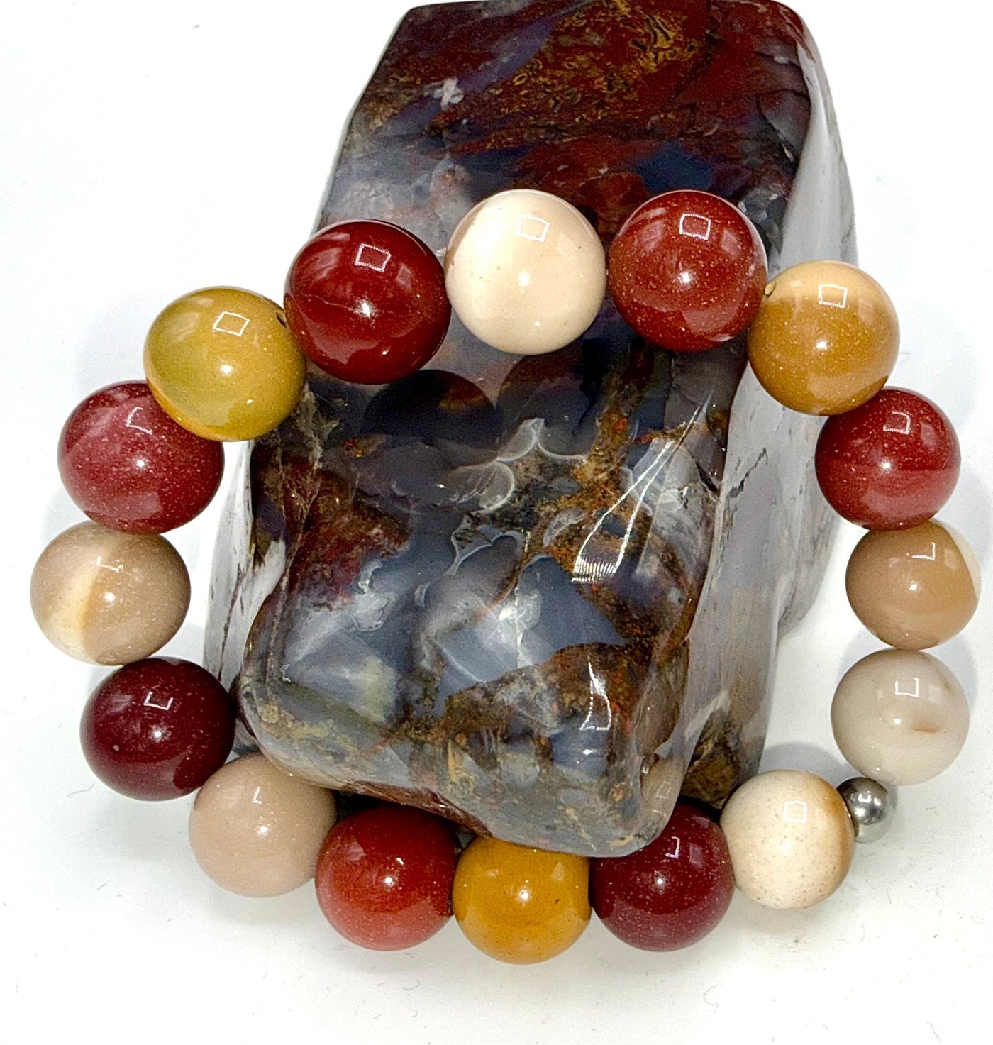 Colorful Mookaite bracelet by STICS and STONES featuring polished jasper beads on a stretch cord.