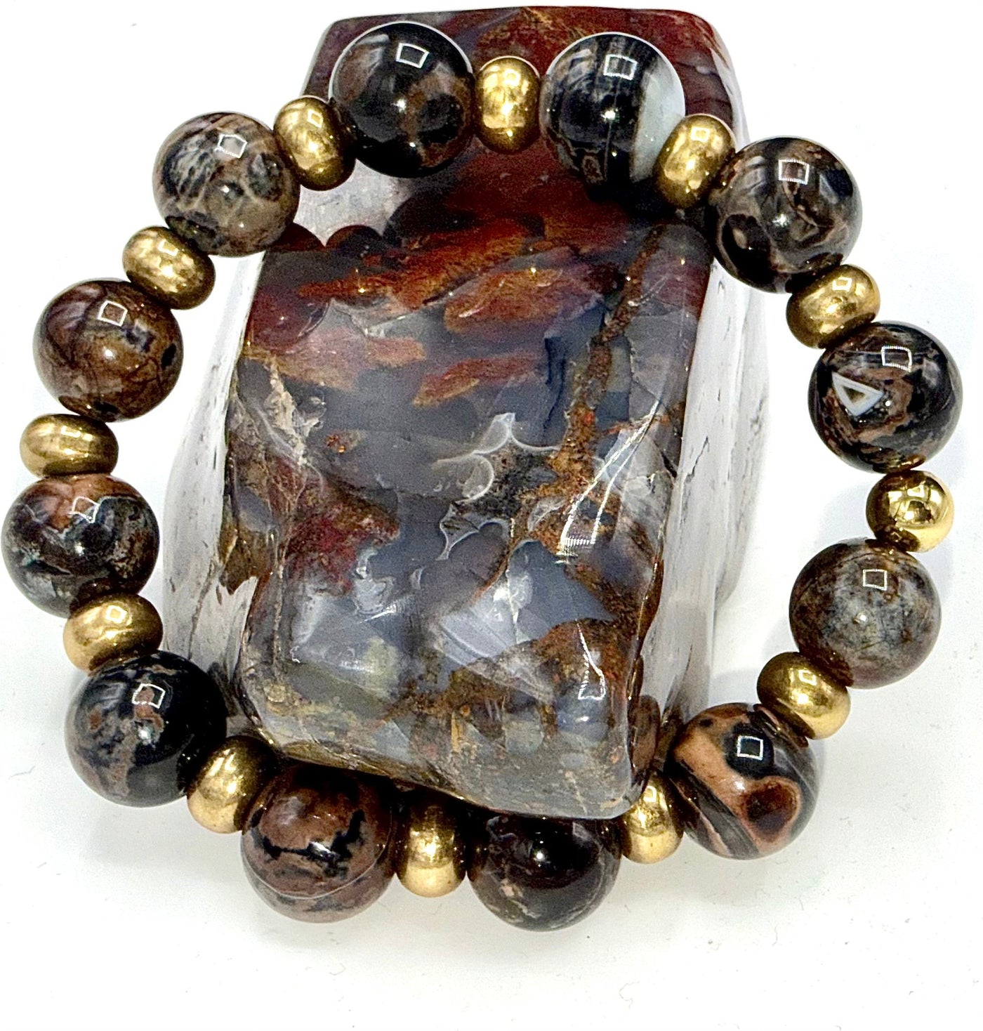 Black and brown lepidolite bracelet featuring polished stones, designed by STICS and STONES, displayed on a neutral background.