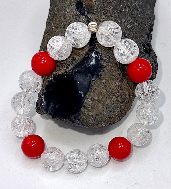 Red and white cracked quartz bracelet by STICS and STONES featuring vibrant gemstone beads and a stylish design.