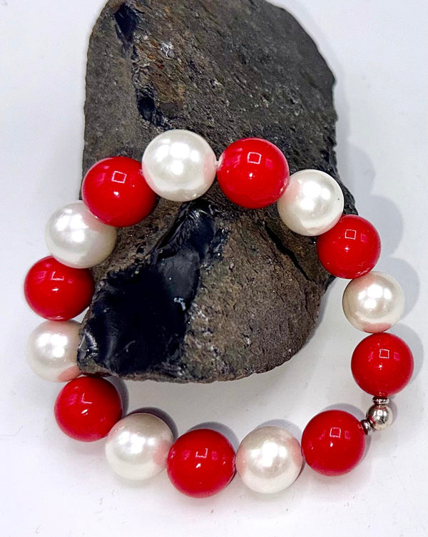 Red and white pearl bracelet by STICS and STONES featuring a stylish design with alternating pearl and bead elements.