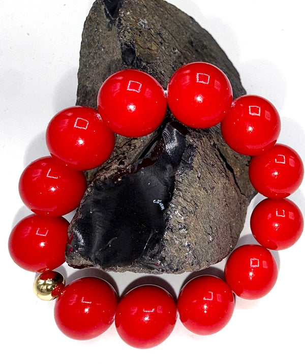 Red bracelet made by STICS and STONES featuring a sleek, stylish design perfect for accessorizing casual or formal outfits.