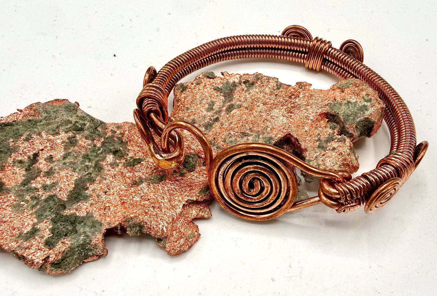 Copper hook-style bracelet from STICS and STONES, featuring a sleek, minimalist design with adjustable hook closure.