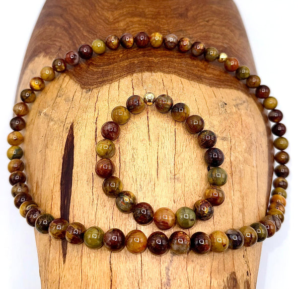 Pietersite jewelry set featuring a necklace and bracelet with polished Pietersite stones, by STICS and STONES.