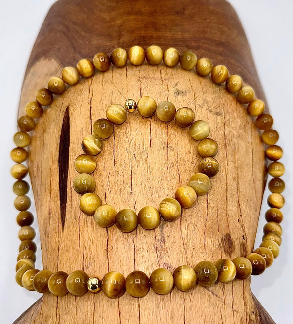 Golden tiger eye jewelry set with matching necklace and bracelet from STICS and STONES, featuring polished tiger eye stones.