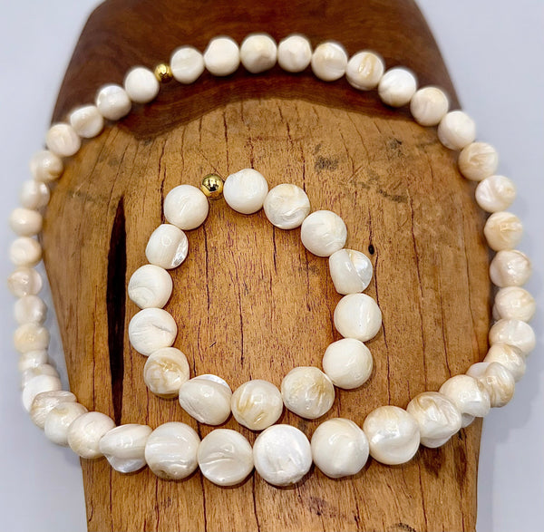 Shell-shaped pearl jewelry set including necklace and bracelet from STICS and STONES, featuring lustrous pearls and elegant design.