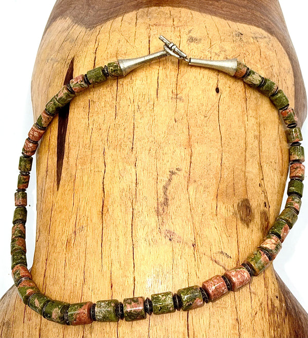 Unakite round gemstone necklace by STICS and STONES featuring polished, multicolored beads on a delicate chain.