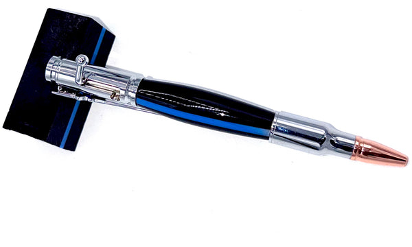 Hand-turned black and blue acrylic pen with thin blue line, crafted by STICS and STONES, displayed on a white background.
