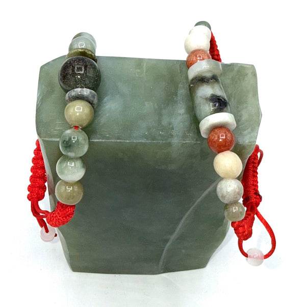 Small jade bracelet with adjustable string from STICS and STONES, featuring smooth jade beads and a secure adjustable clasp.