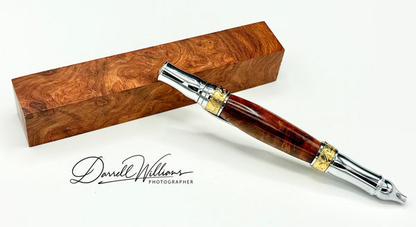Hand-turned Amboyna Burl pen by STICS and STONES, showcasing rich wood grain and elegant design, No. 2 model.