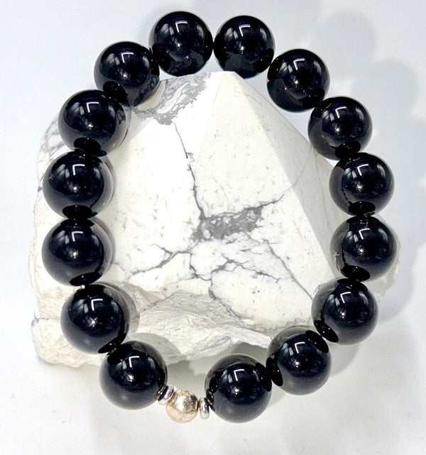 Black Onyx Bracelet by STICS and STONES featuring polished black onyx beads and a secure clasp.