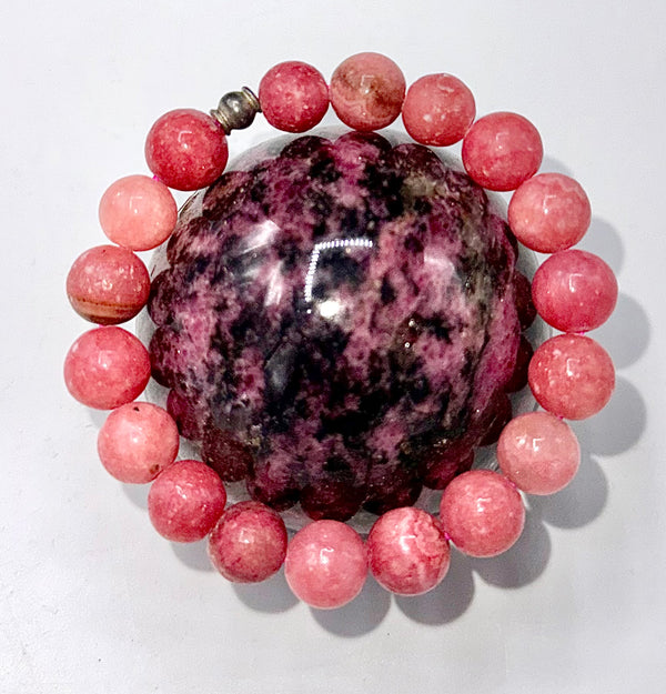 Rhodochrosite bracelet featuring polished pink stones on a delicate string, designed by STICS and STONES.