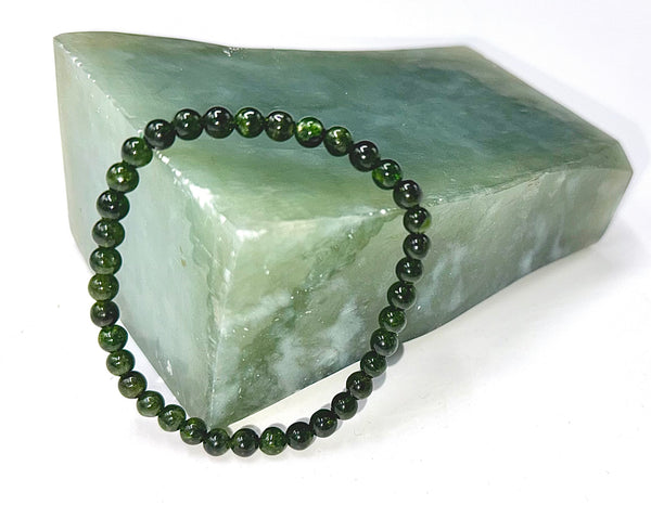 Green Diopside bracelet from STICS and STONES featuring polished green gemstones on a flexible band.