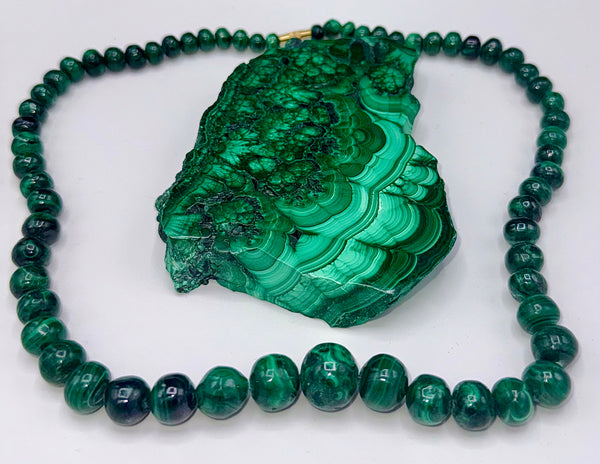 Malachite necklace from STICS and STONES featuring polished green gemstone beads and a silver clasp.