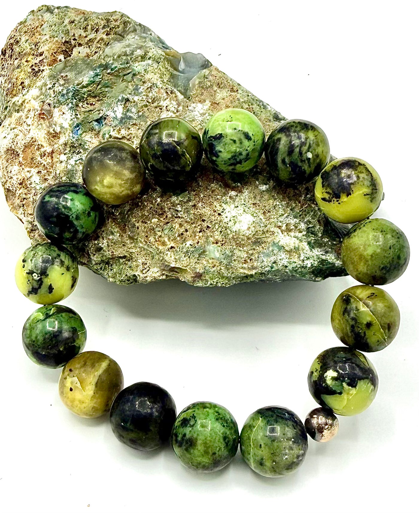 Green serpentine bracelet by STICS and STONES featuring polished serpentine stones and a simple clasp design.