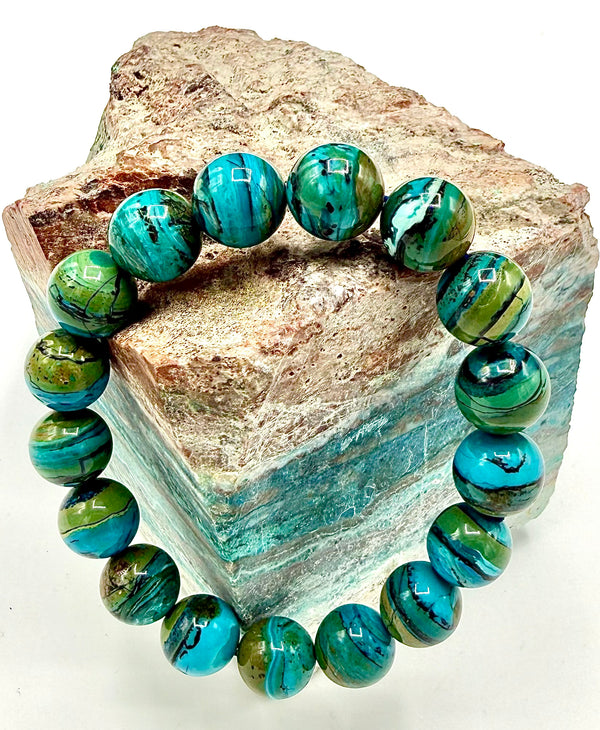Chilean Opal bracelet from STICS and STONES featuring vibrant, polished opal beads on a delicate string.