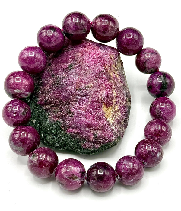 Ruby Zoisite bracelet featuring polished gemstone beads, crafted by STICS and STONES, showcasing vibrant red and green hues.