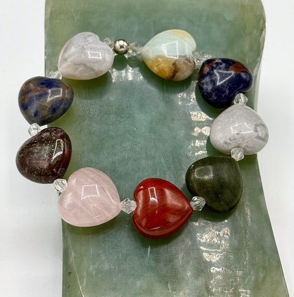 Heart-shaped stone bracelet by STICS and STONES featuring smooth, polished stones on a delicate bracelet chain.