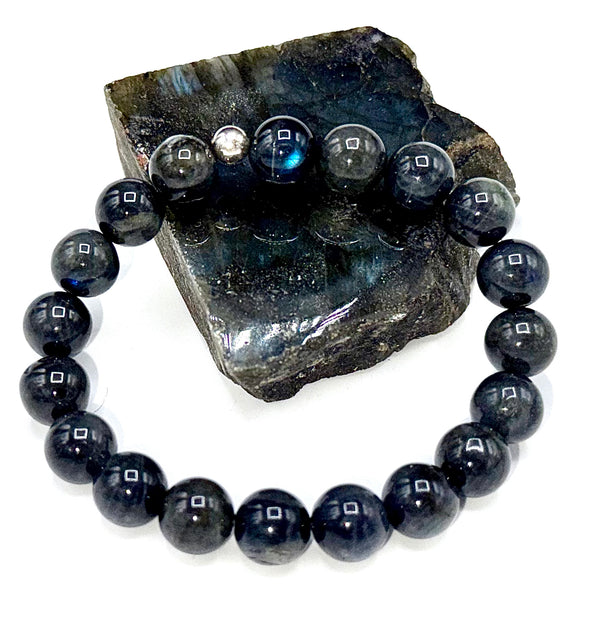 Dark blue Labradorite bracelet by STICS and STONES featuring polished, oval-shaped stones on a delicate elastic band.