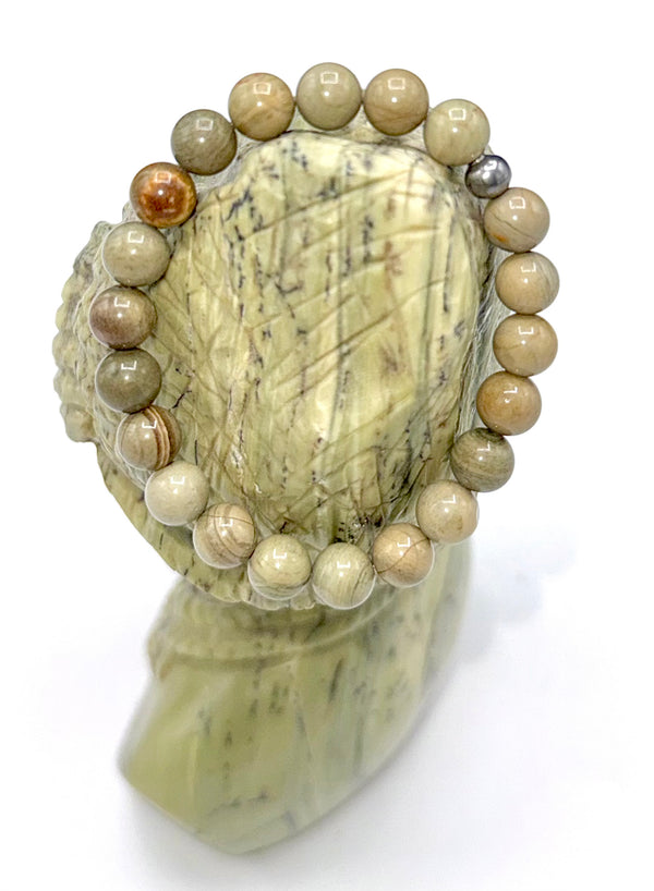 Butter Jade bracelet by STICS and STONES featuring smooth, polished jade beads on a stretchy cord.