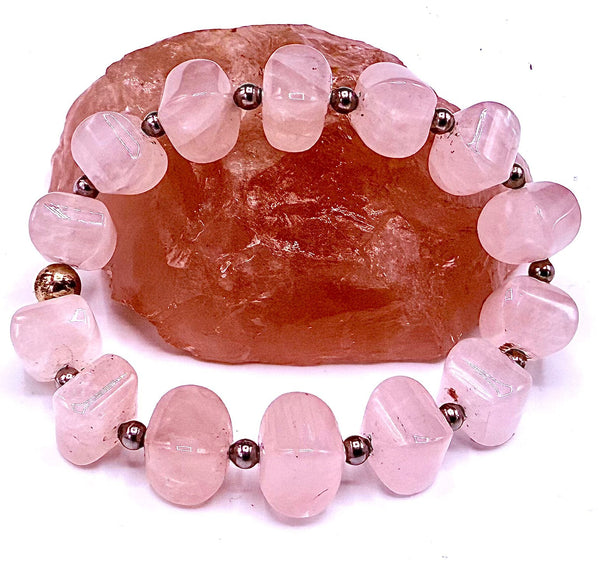 Rose Quartz bracelet from STICS and STONES featuring polished pink gemstone beads on a stretchy cord.