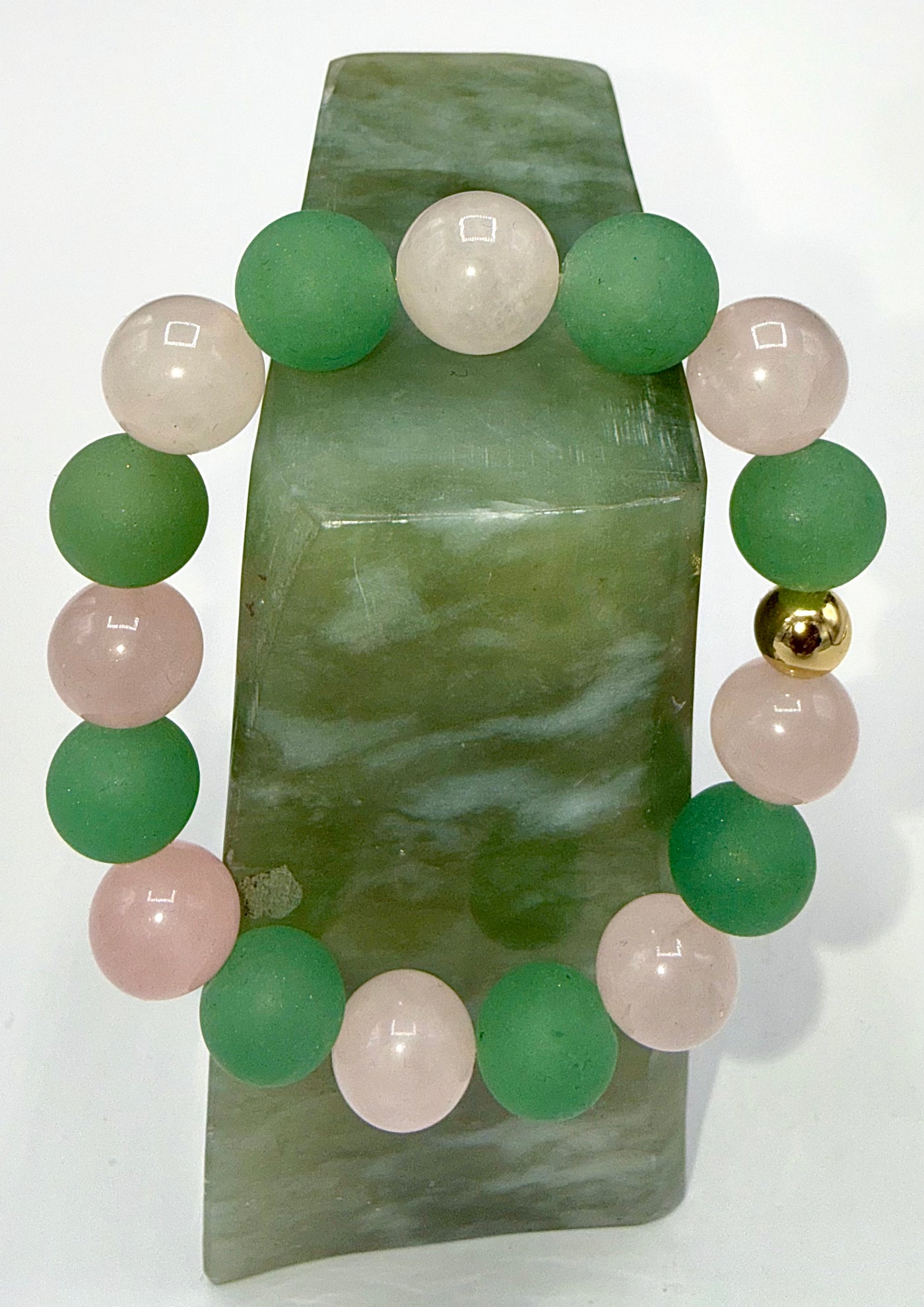Green Aventurine and Rose Quartz bracelet with beaded design, featuring natural gemstones on a stretchy cord.