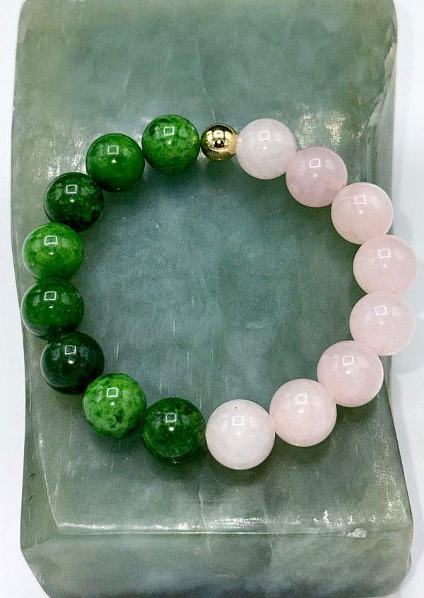 Rose quartz and African jade bracelet featuring polished beads, crafted by STICS and STONES. Natural stone jewelry accessory.
