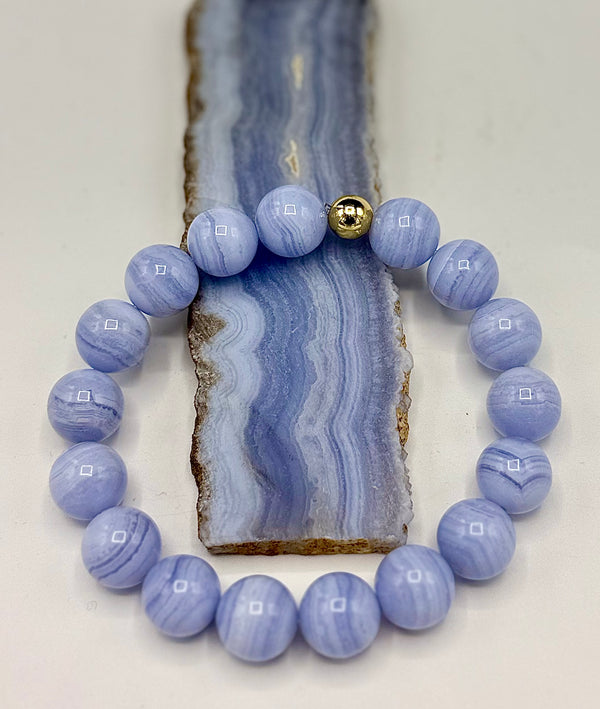 Blue-laced agate bracelet from STICS and STONES featuring polished beads and a secure stretch cord.